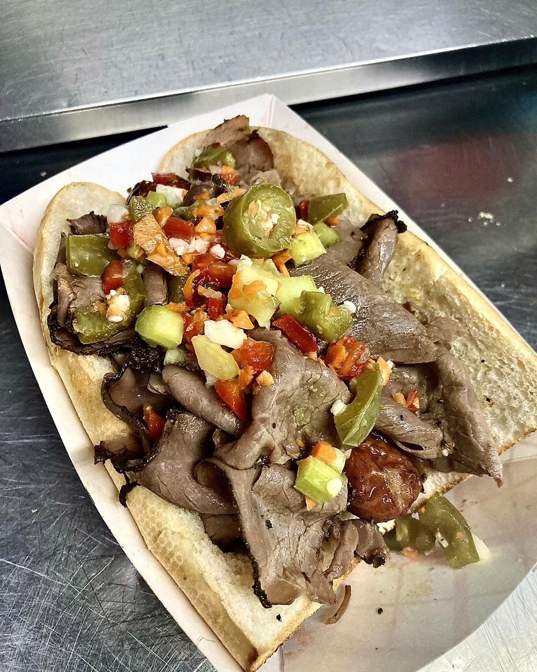 Italian beef sandwich loaded with Mama D's giardiniera
